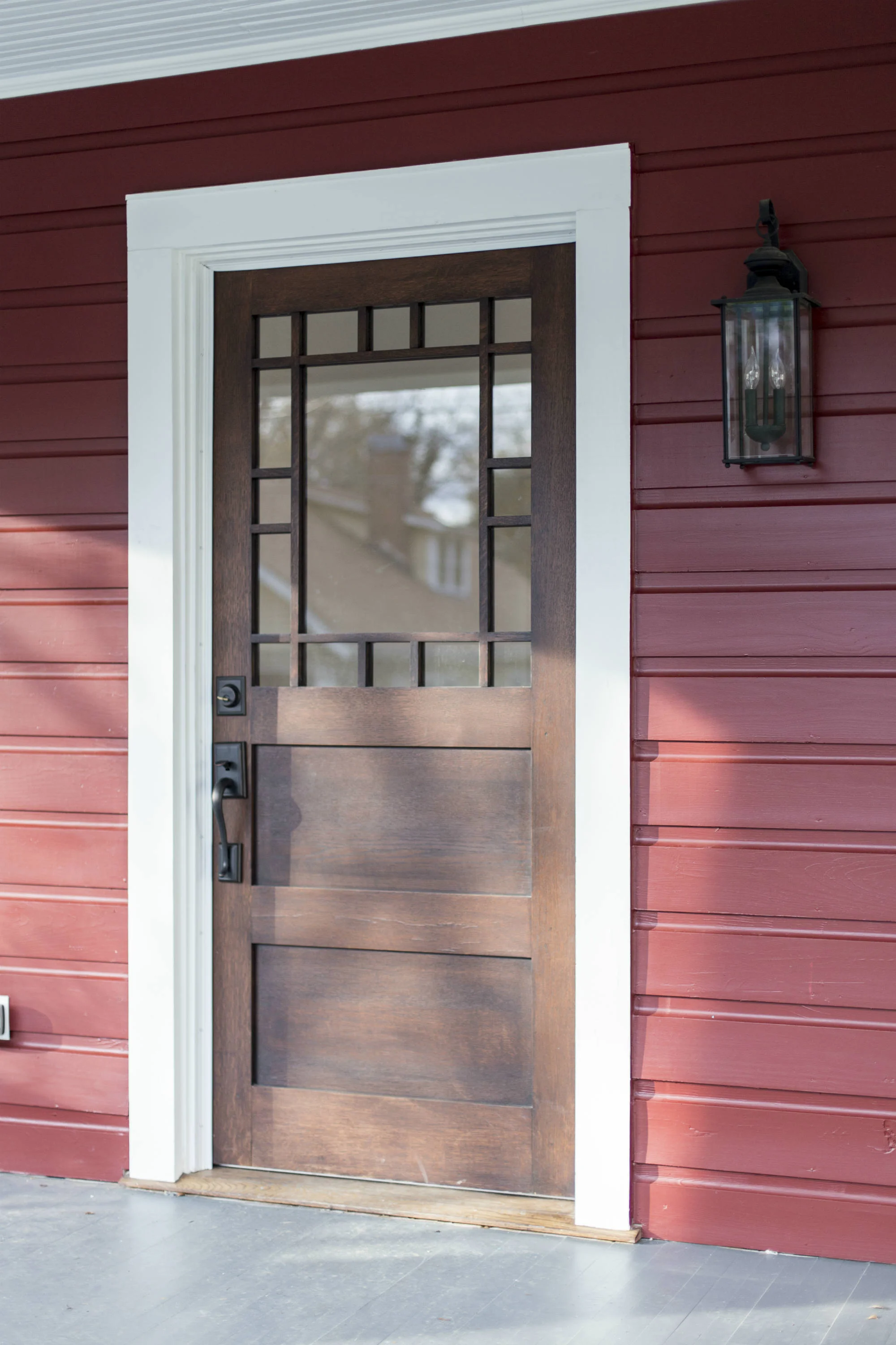 Box-Custom-Millwork-Durham-NC-brown-door-red-siding-1.jpg