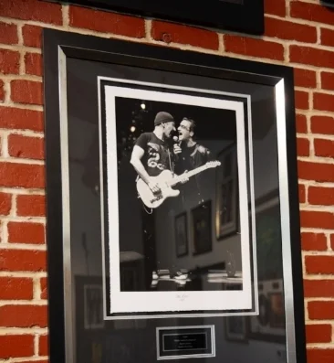 The Edge + Bono of U2, signed photograph + record (not pictured)