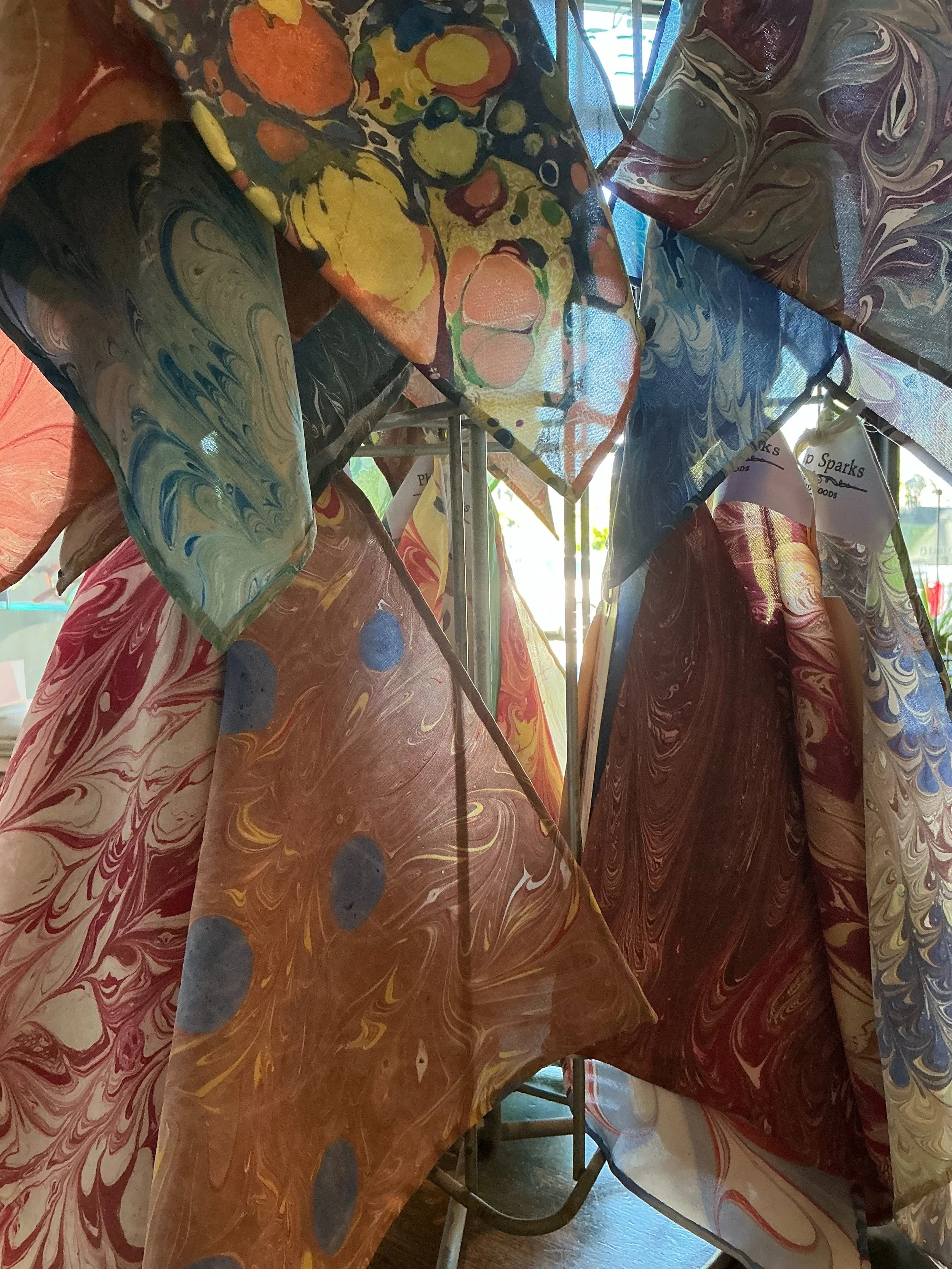 A beautiful day in the shop! Door is open, there is a cool breeze, and the sun is bright. Here we see the light through some of our silk pocket squares- marbled in house, and with hand rolled edges. 
Enjoy the weather!

#torontobespoke #torontotailor