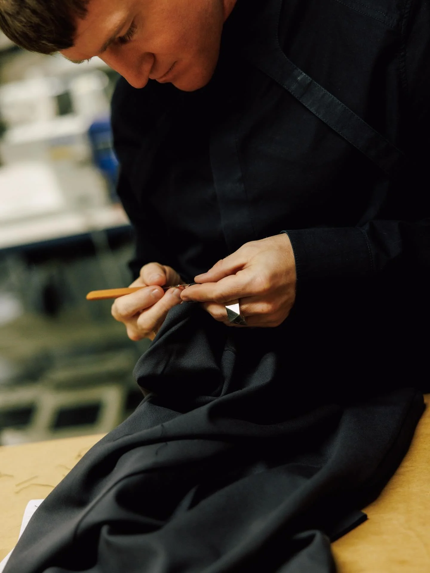Another photo from @jkf_man visit to our studio. This one is of Sean, one of our tailors in the shop. Sean is missing from our August Birthdays post as he&rsquo;s off on a well deserved  vacation from the shop. 

#tailor #bespoketailor #torontotailor