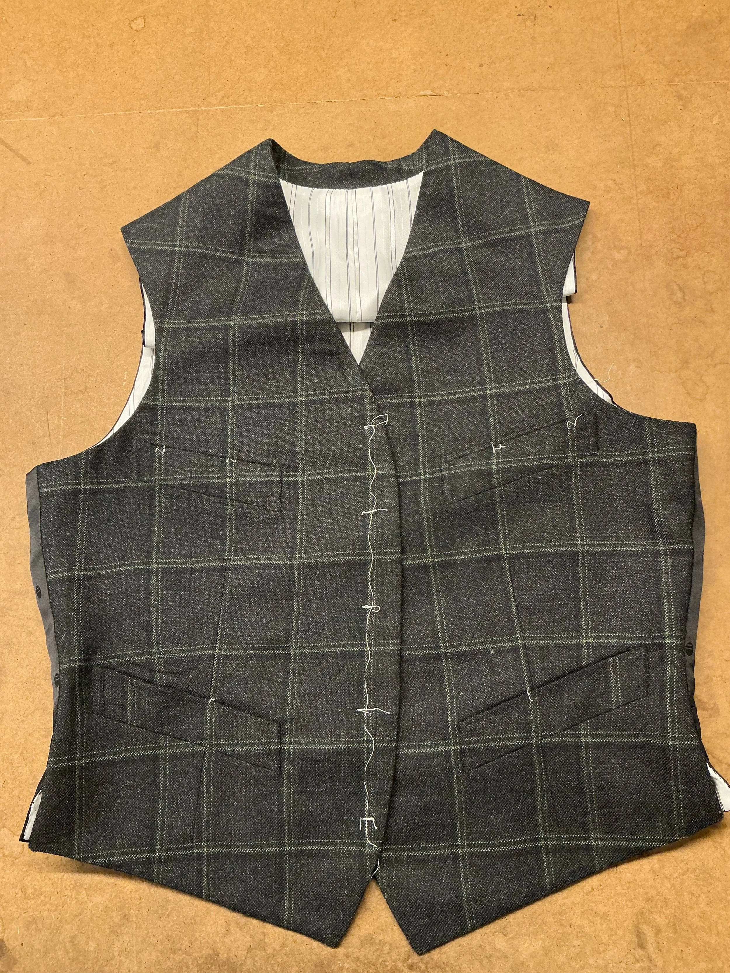 Classic details and classic materials. Soft checked wool flannel, crisp silk, durable striped lining, making up into a beautiful waistcoat. Of course we love the large over the top unique pieces, but there is something undeniable about a well put tog