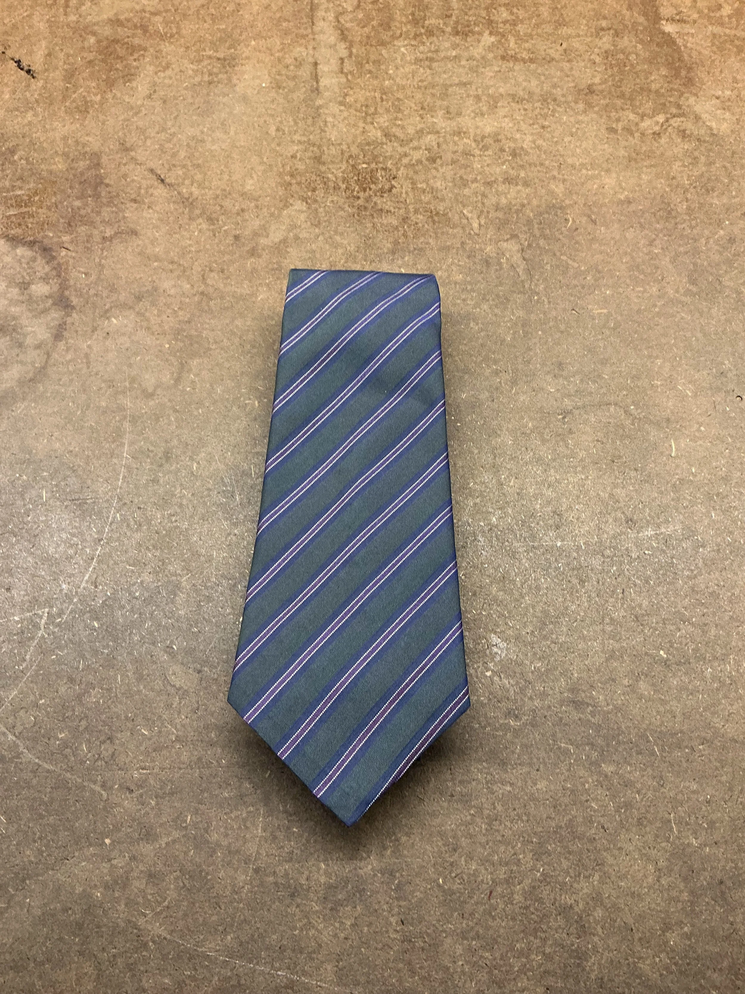 Loving our new Italian tie silks, here in an iridescent purple-green. Accessories can make or break the impression of an outfit, and we can make something to match your suit perfectly! Lovingly hand sewn, embroidered initial, and finished with a silk