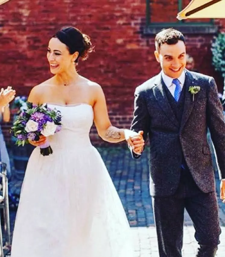 Groom wearing a bespoke three-piece wedding suit made at Philip Sparks tailor shop in Toronto