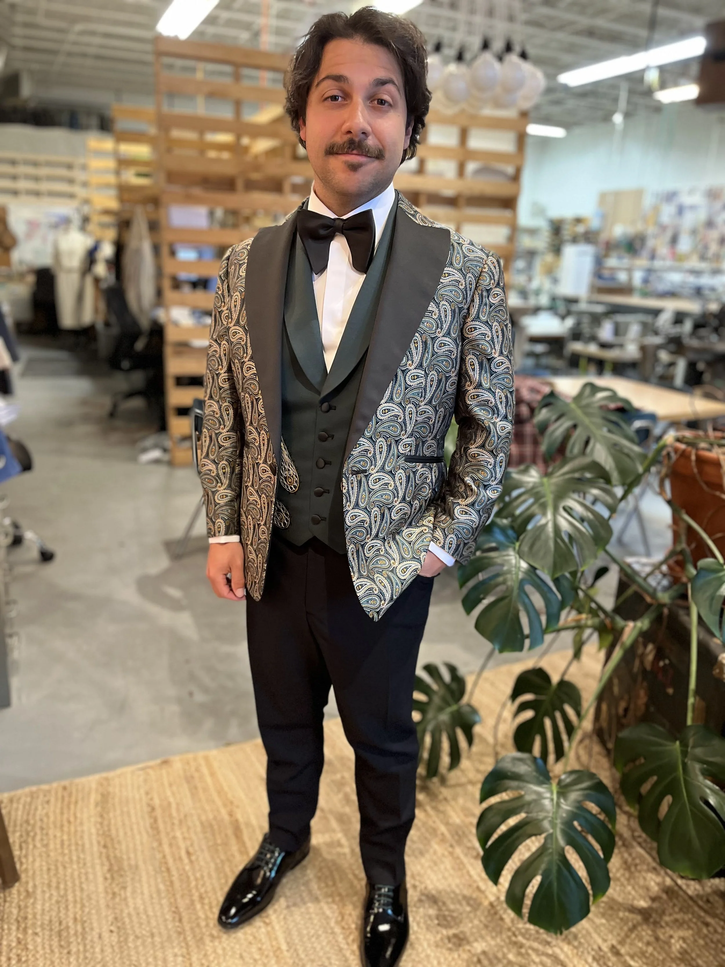 Variation on a Bespoke Tuxedo in a Brocade Cloth with Contrasting Vest and Trousers all made in the Philip Sparks shop. This jacket is single breasted with a peaked collar.