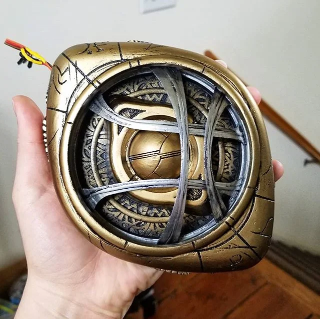 Some hand carving, damage with a file, and weathering goes a long way for this one.

The runes were carved using a combination of a soldering iron and a Dremel before the base coat of primer was applied. Black shoe polish was used for weathering, as 