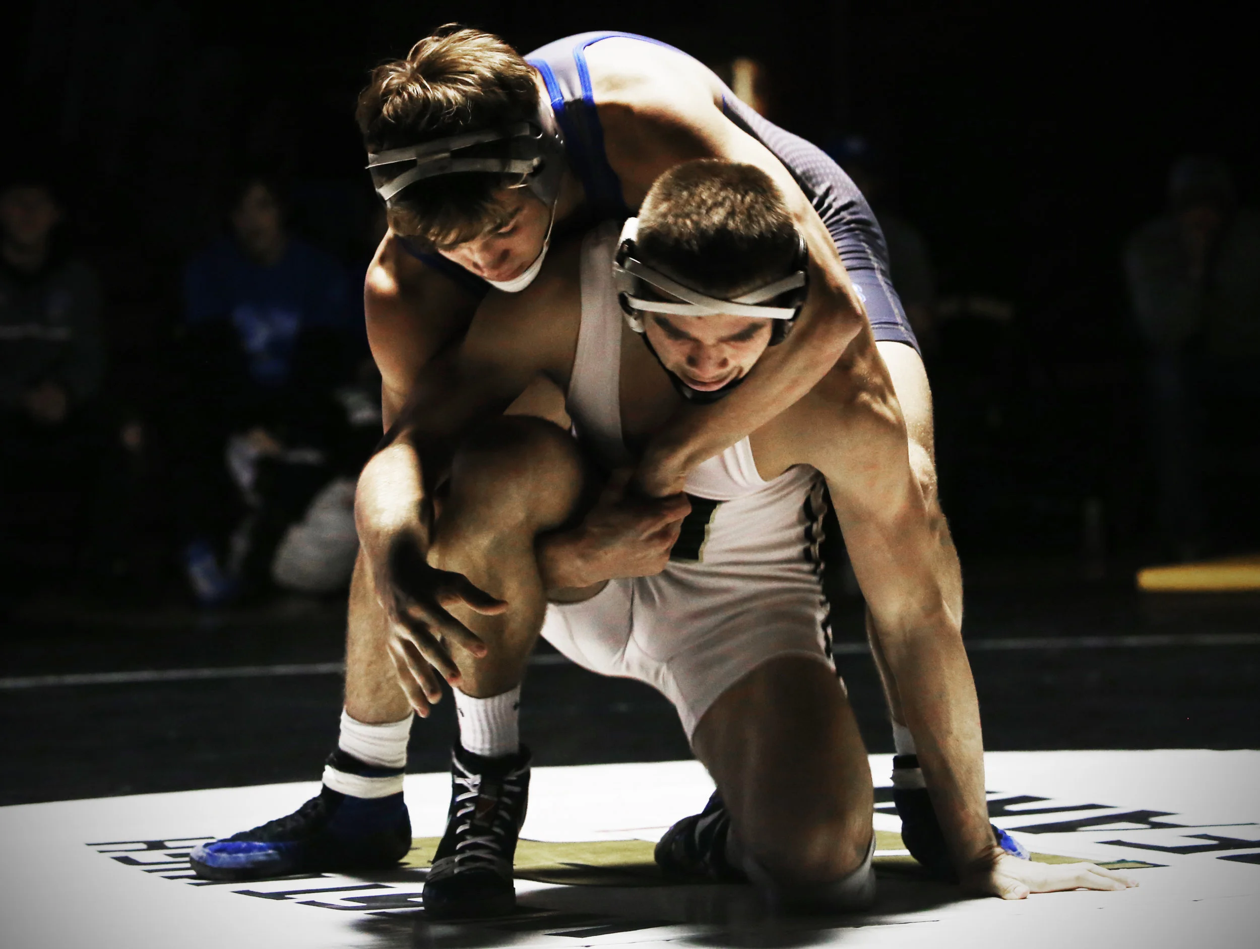 Billings Skyview's Brock Bushfield and Billings West's Jace Rhodes meet in the middle for their match at the Golden Dome in Billings.
