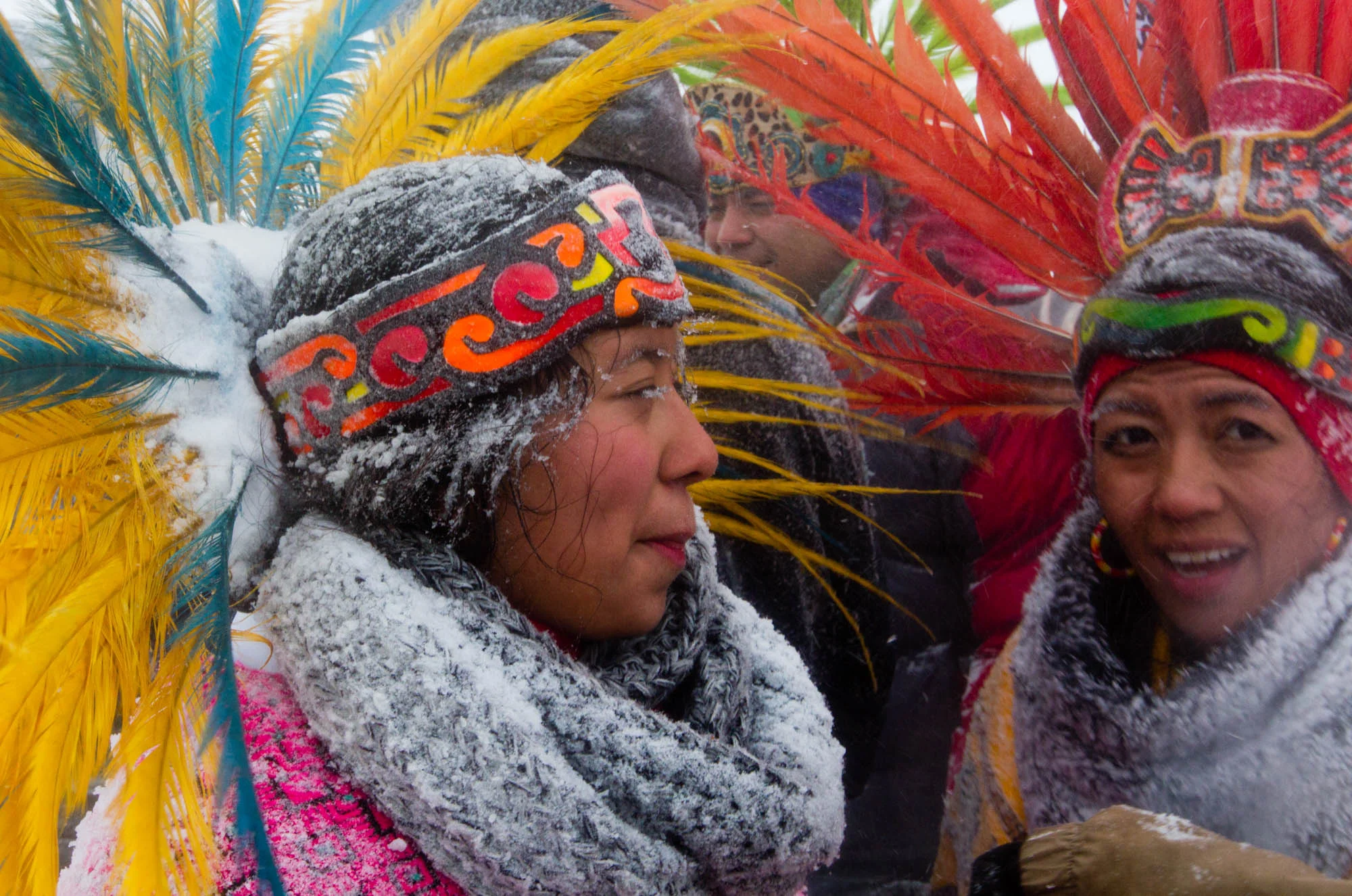 Snow dusts Alquetzali Quirozo's eyelashes and regalia as she walks along highway 1806 back to the Oceti Sakowin Camp. Quirozo danced with her parents during the veterans march to the frontlines on December 5, 2016.