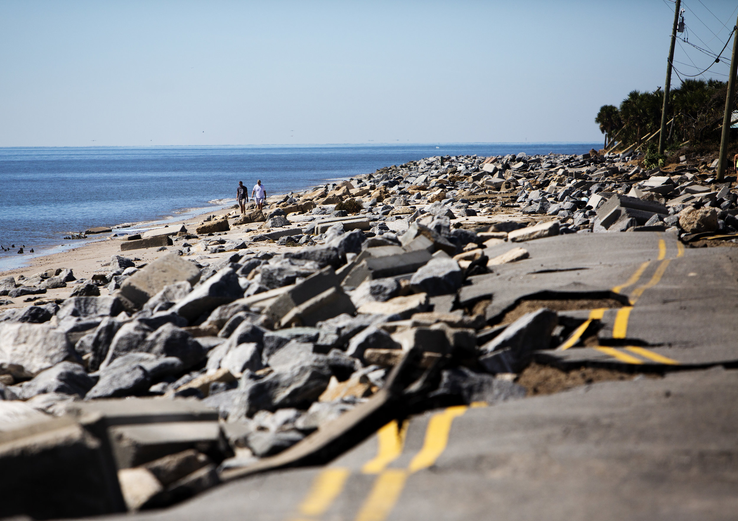  People walk around the destroyed portion of Alligator Drive in Alligator Point on October 12, 2018. Alligator Drive, along with several structures were destroyed in when Hurricane Michael hit the area. 