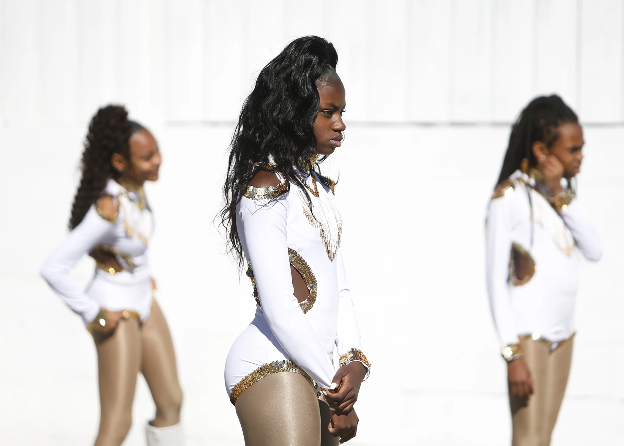 Jayla Reddick, 11, center, Keliss McClira, 11, right and Amaurie Anderson, 13, left, wait for directions during a Prancing Dancerettes rehearsal before performing at the 30th Annual City of Tampa Martin Luther King Day Parade on Monday, January 21, 2019 in Tampa, Florida.