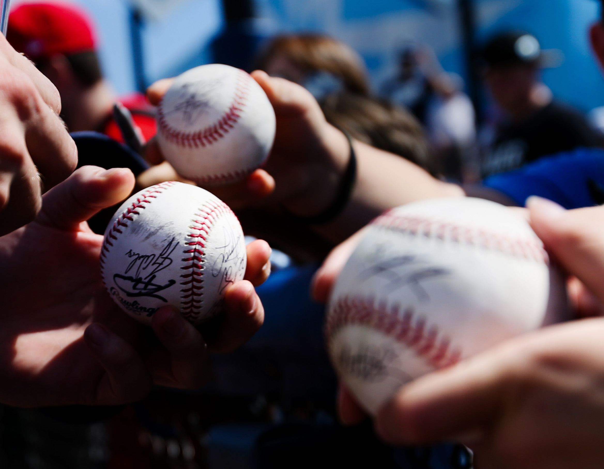 Tampa Bay Rays relief pitcher Ryne Stanek (55) signs baseballs for fans before the game between the Philadelphia Phillies and the Tampa Bay Rays at Charlotte Sports Park in Port Charlotte, Fla. on Friday, Feb. 22, 2019.