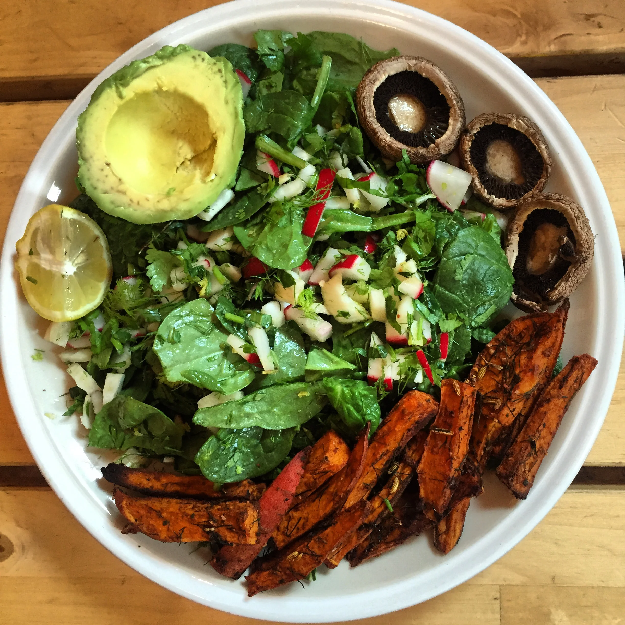 1) veggie base of spinach, herbs, radish and roasted mushrooms with olive oil and lemon juice 2) Density 1: Roasted sweet potato fries 3) Density 2: 1/2 an avocado
