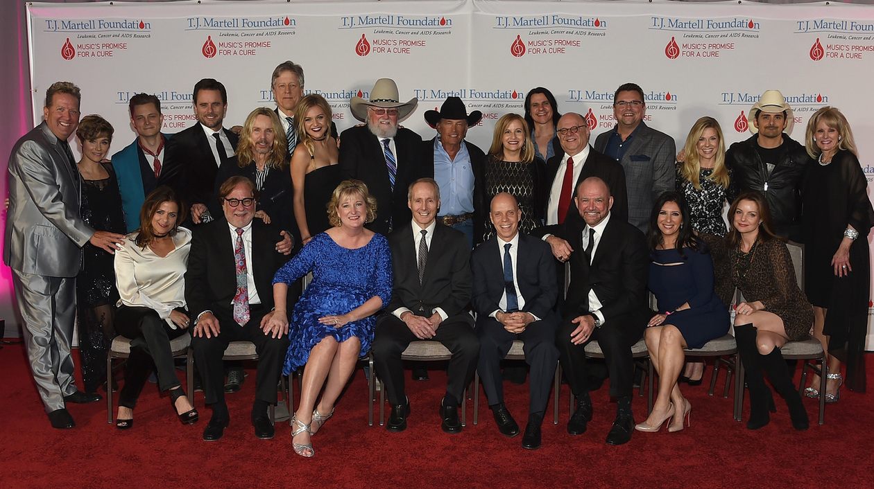 Front row L to R: Co-chair Ali Harnell; honorees Rod Essig, Janet Miller, Dr. Joseph Smith, Scott Hamilton and Louis Messina; Co-chair Danielle Bouharoun and Kimberly Williams Paisley; Back row L to R: Shawn Parr, Clare Bowen, Frankie Ballard, Charles Esten, Tommy Shaw, John Huie, Kelsea Ballerini, Charlie Daniels, George Strait, Nashville Mayor Megan Barry, Will Evankovich, Joel Katz, Storme Warren, Tracie Hamilton, Brad Paisley and the T.J. Martell Foundation's Laura Heatherly attend the 9th Annual Nashville Honors Gala at Omni Hotel on February 27, 2017(Photo by Rick Diamond/Getty Images for T.J. Martell Foundation)