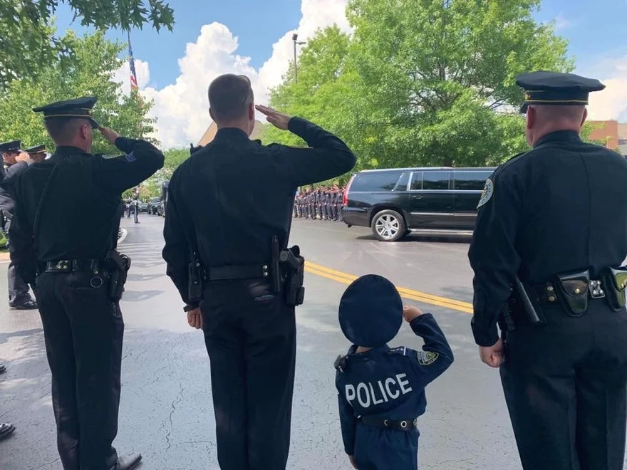 Son of Sonya Isaacs and Jimmy Yeary offers support at fallen Officer Anderson's service