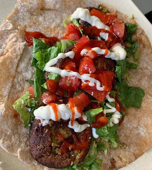 Leftovers Lunch! Homemade falafel from #meatlessmonday with shredded romaine, diced tomato, siracha and mayo on WW wrap. #meatless #vegetarian #healthy #leftoverlunch