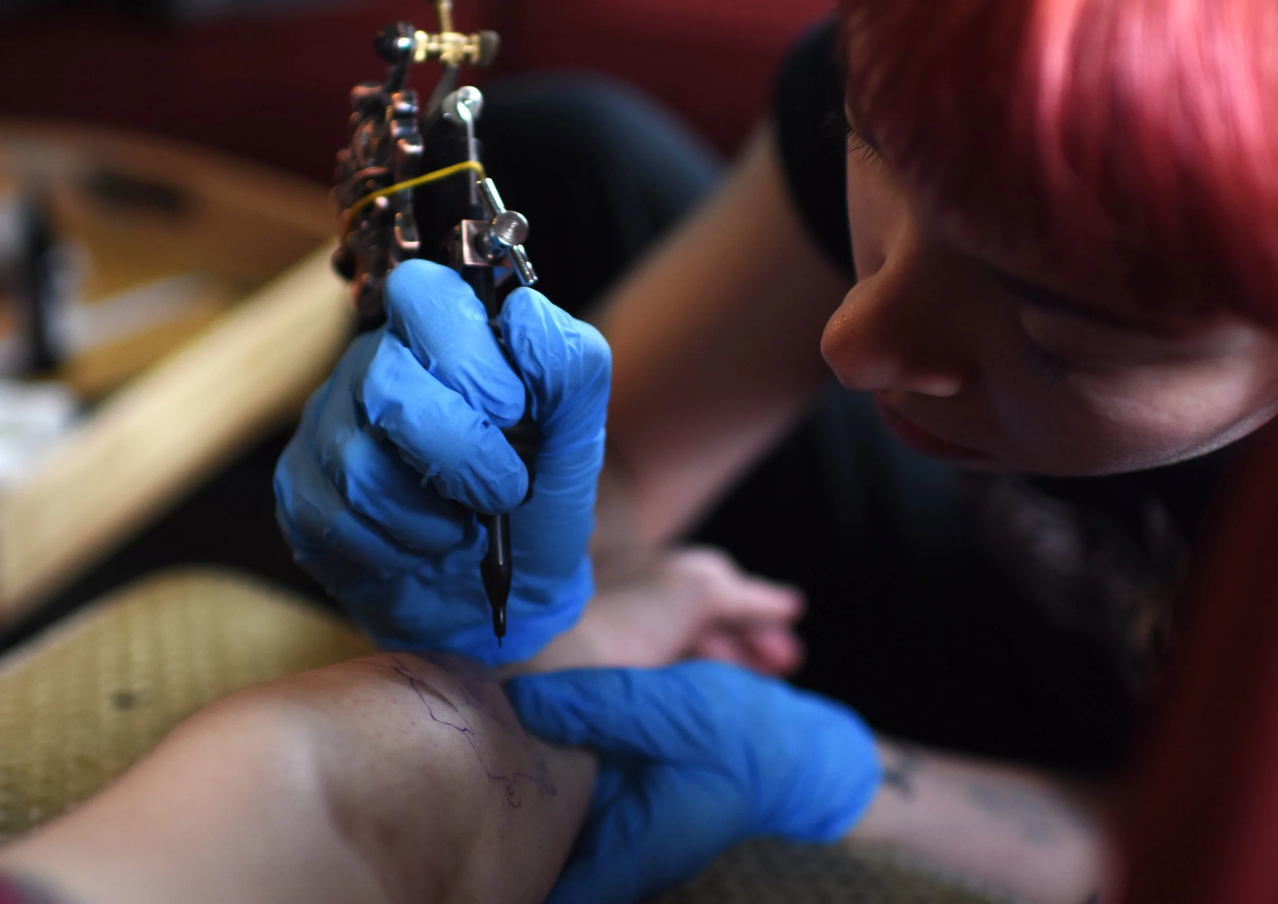 Briana gives Alyssa a tattoo, which they named Loretta. Briana is an artist and recently began tattooing. This specific tattoo was designed by Briana herself. She will have her second art show on May 4 at Sager Braudis art gallery. Her art show is the same night as Gay House's next show.