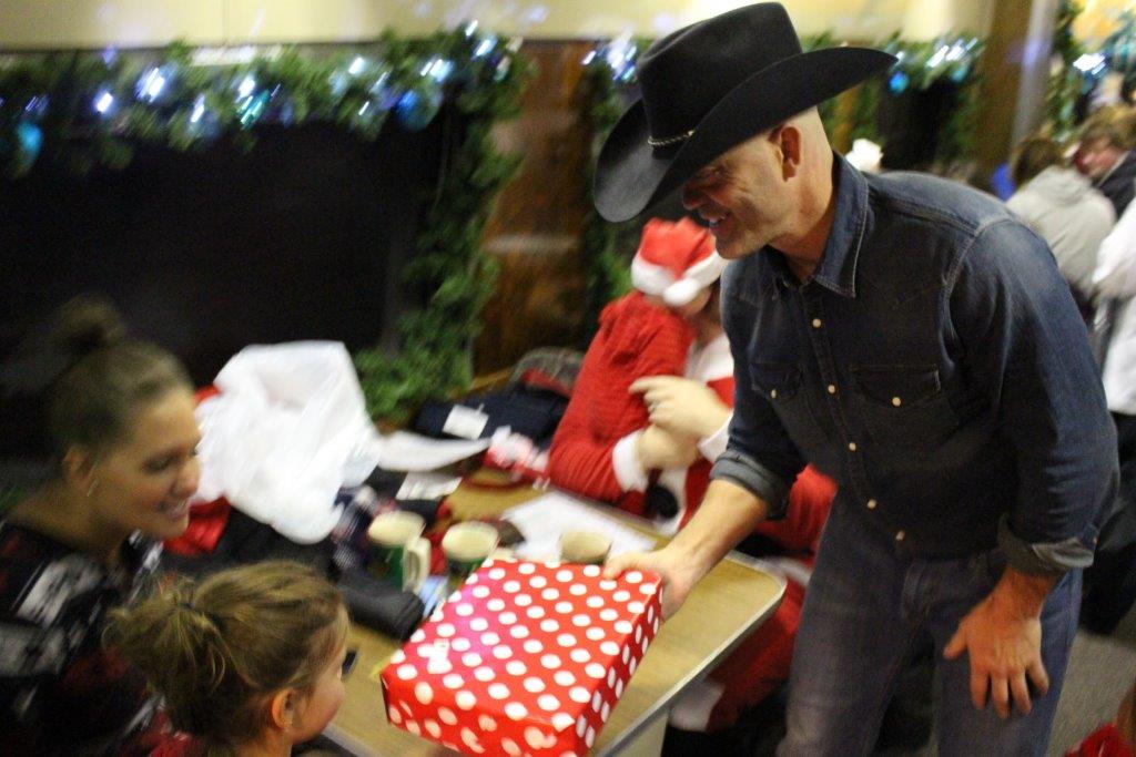 Butch handing out presents.jpg