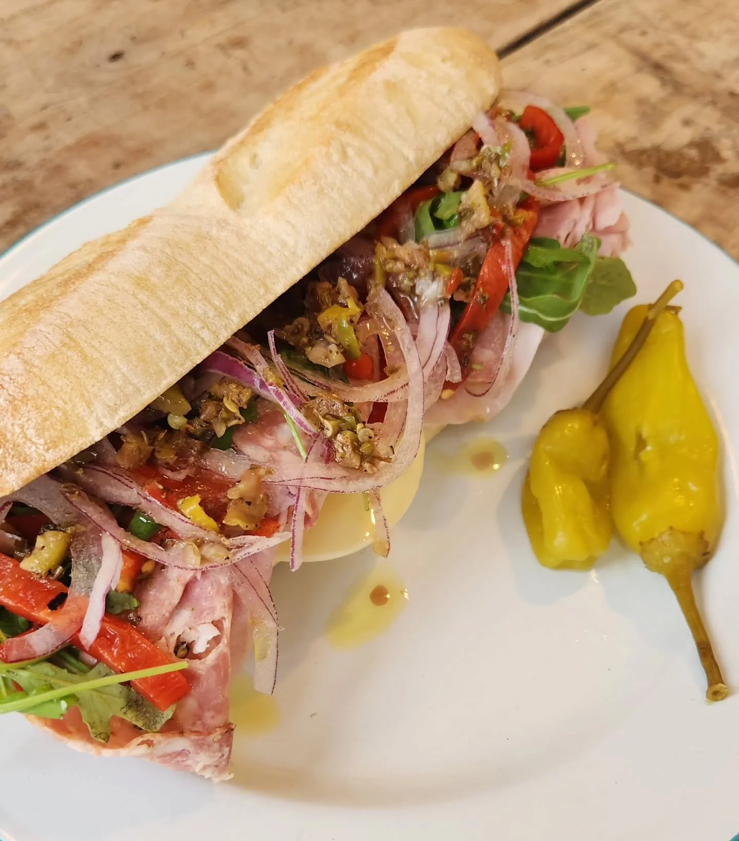 Metro North Sandwich Special! Ham, Salami Cotto, provolone, arugula, roasted red peps, and red onion with an olive oil + oregano vinaigrette on a big ol' 10 inch Hoagie roll. She'll fill ya up gooooood, get on in here! Or call it in and pick it up an