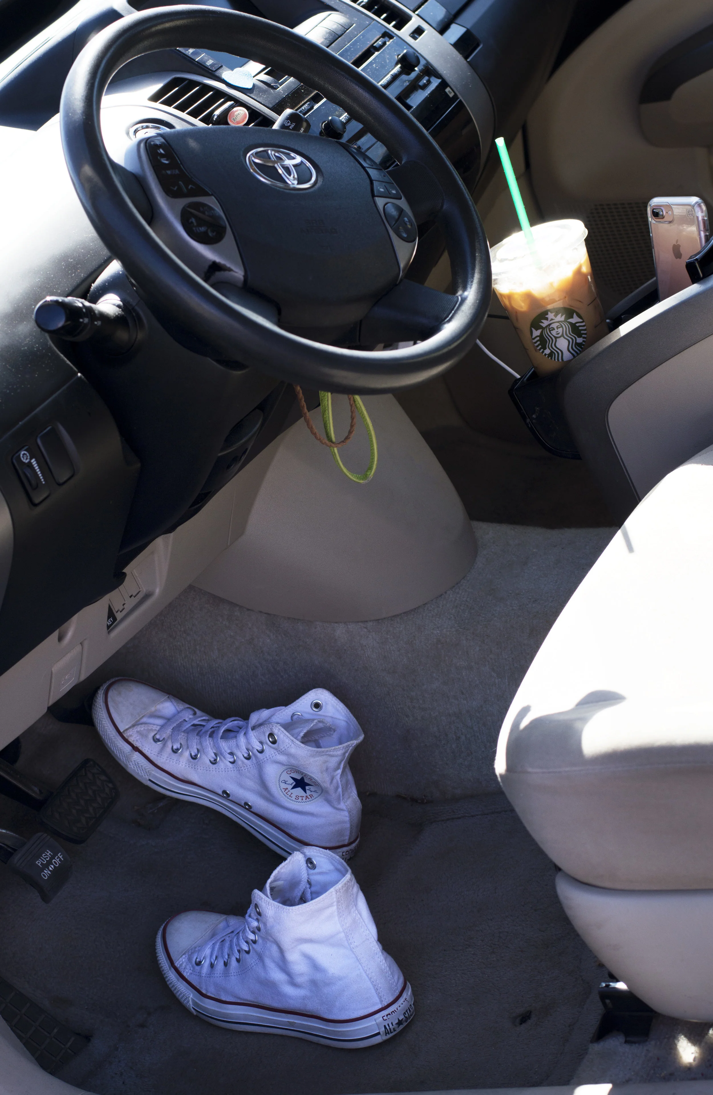 This is me... where it seems like I spend a good majority of my time. I've put over 50,000 miles on my little Prius in a year and a half's time. I depend on my car to safely get me and my kids to all of the different places we go. Also pictured are my other two dependencies: Starbucks is my fave but just coffee in general, and my phone. 