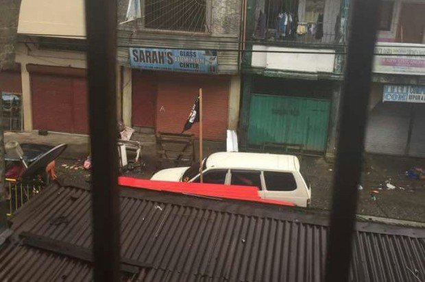 An Islamic State flag is seen at Marawi City where fierce fighting between government security forces and the Abu Sayyaf and Maute groups is raging. CONTRIBUTED PHOTO