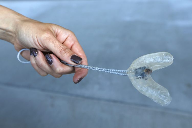 Erendira Wallenda shows off the mouthpiece that will be her connection between the helicopter and Niagara Falls. (Robert Kirkham/Buffalo News)