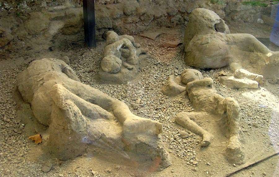 A family huddled together in the ruins of Pompeii. Andrew Mason/Flickr