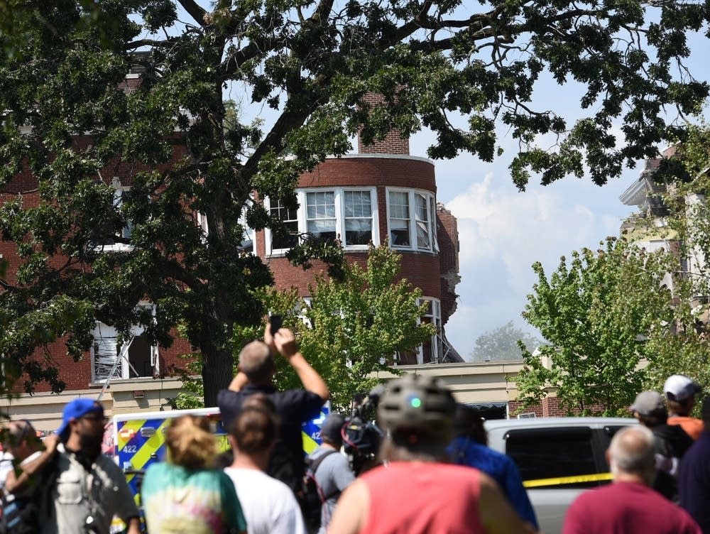 Three people were rescued off the roof of one of the buildings, and another person believed missing was found uninjured. Caroline Yang for MPR News