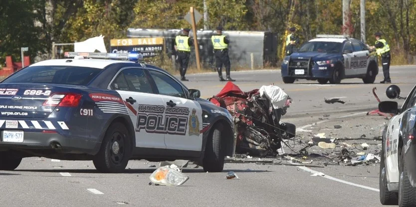 The remains of a car that struck a transport truck head on on Highway 6 Thursday morning can be seen strewn across the road. A man and a woman in the car were killed in the collision. Waterloo Regional police had tried to stop the car following an incident on King Street in Cambridge. - John Rennison,The Hamilton Spectator