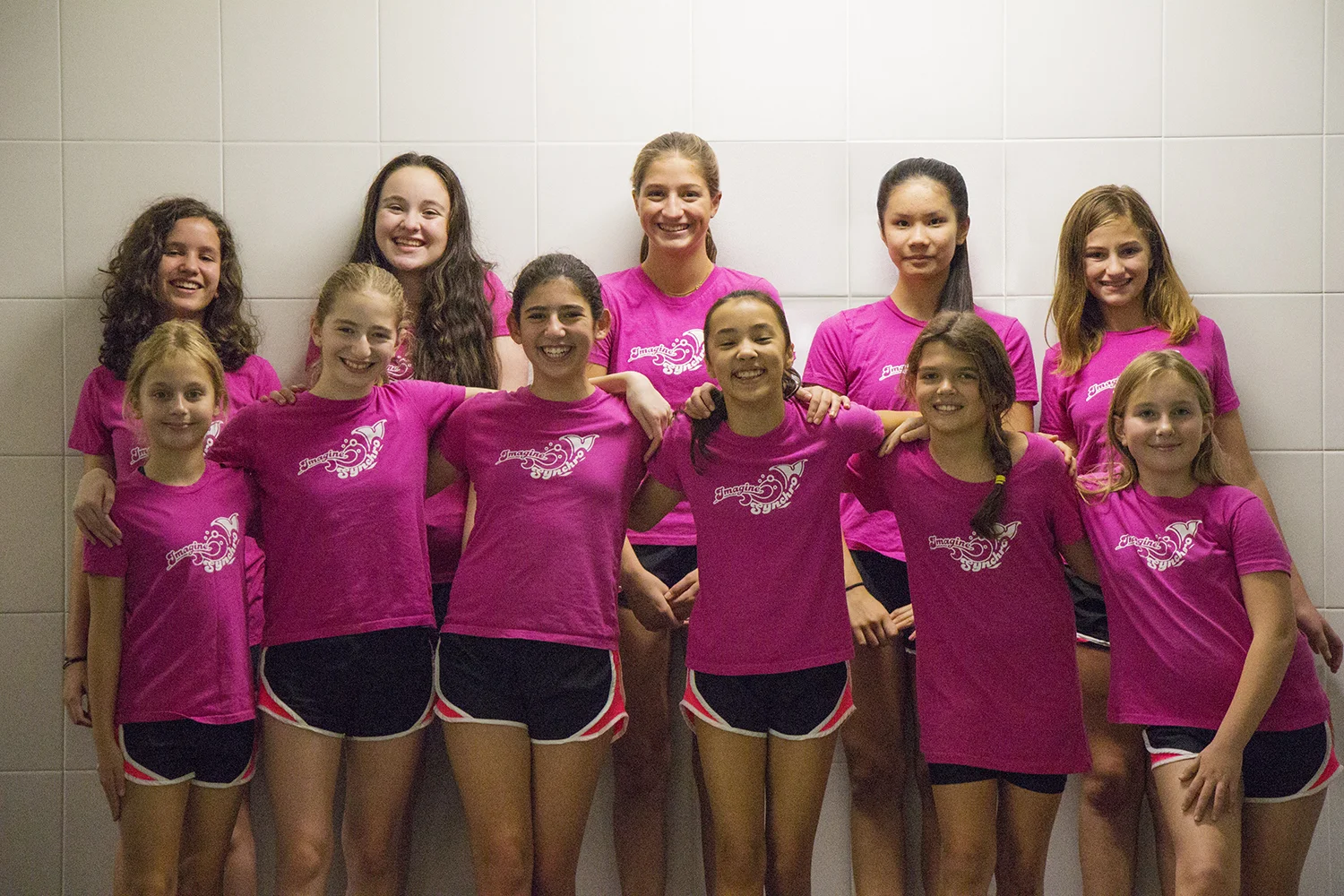 Team photo wall smiles.jpg