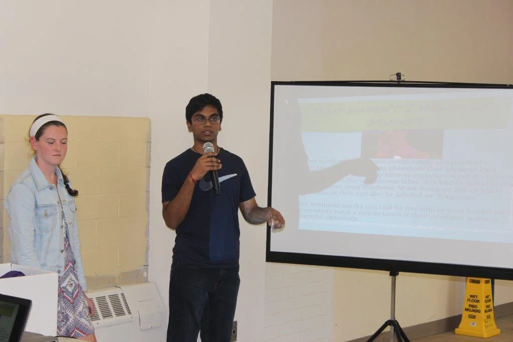Karthi speaking at an outreach at the Senior Center