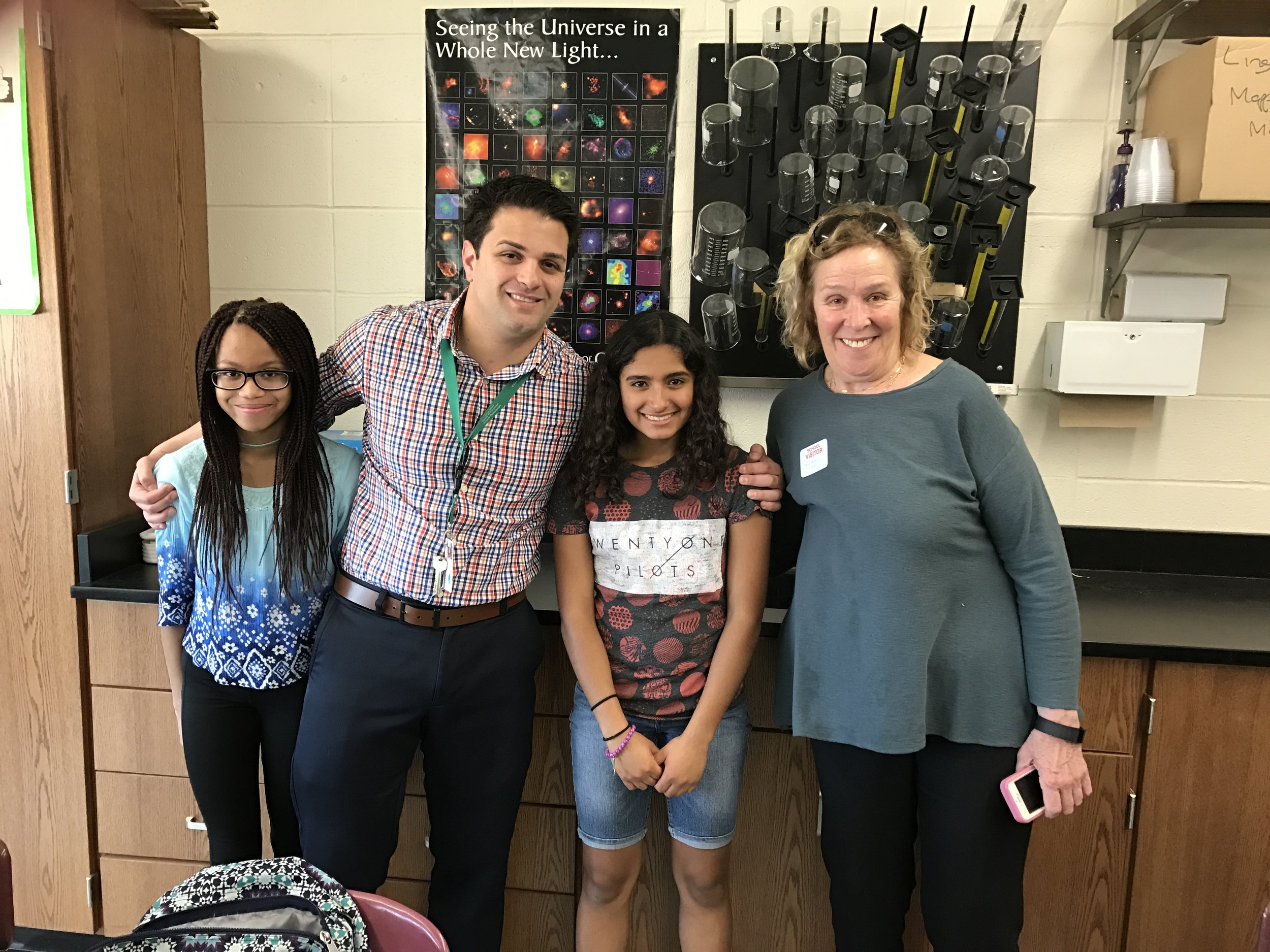 Alexa and Erin teach their classmates about indicator species and personal care products