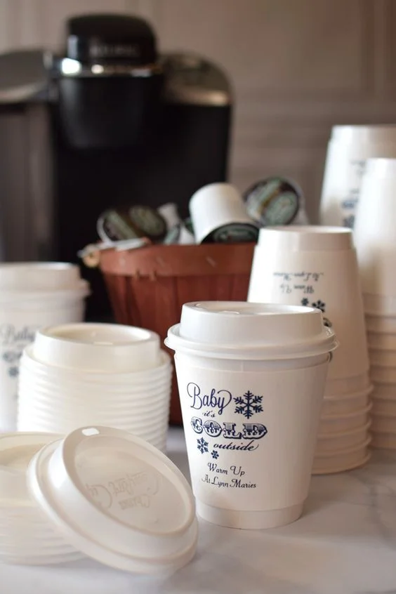 And why stop at the hot chocolate and sweet treats at your wedding? Did you know that you can get customized coffee cups and holders for your wedding? How cute is that idea?