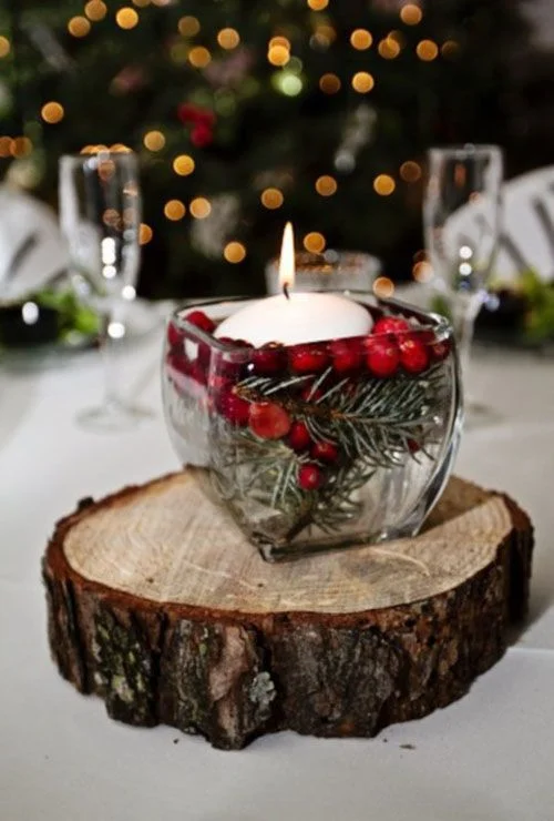 Here we have another winter centerpiece quite similar to the first photo, but here we have a nice combination of red and green within the candle itself.