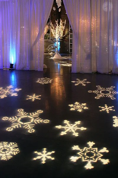 What do you think about the idea of using projection lighting for snowflakes on the dance floor? Or, perhaps, hearts or abstract art? 