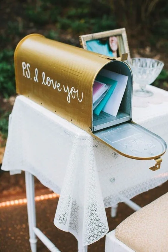 Maybe you want to toss out the whole wedding guest book idea and go with something slightly different. I love the idea of an old-school, classic, and traditional mailbox for hand-written letters from your wedding guests. 