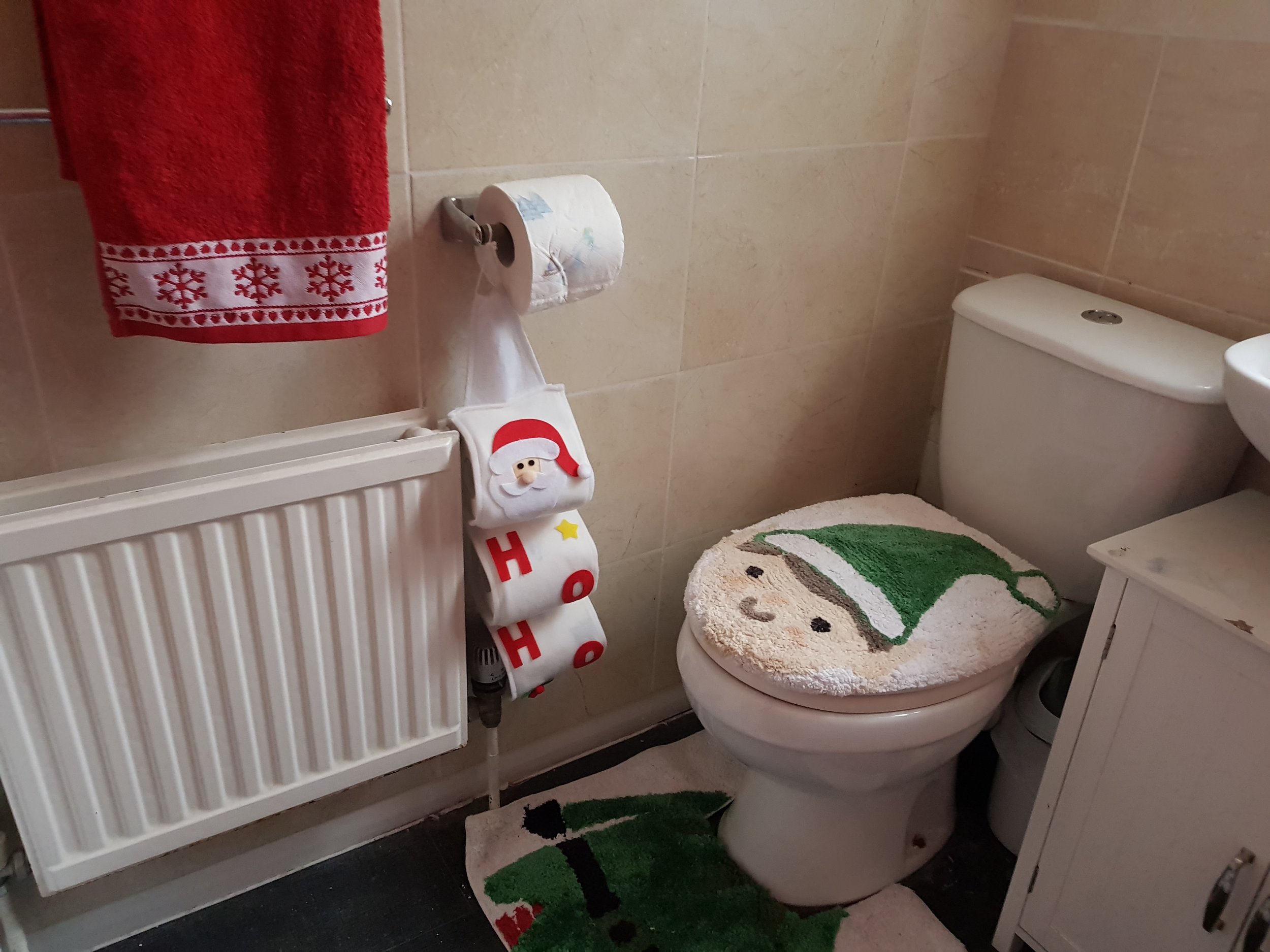 Christmas toilet cover, toilet rolls and towels