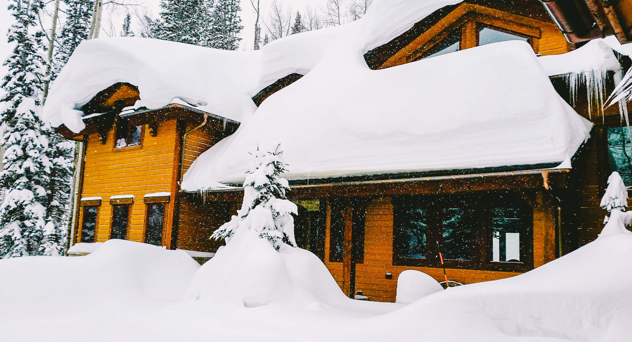 Snow Piling up on a Park City Homeowner's Roof.