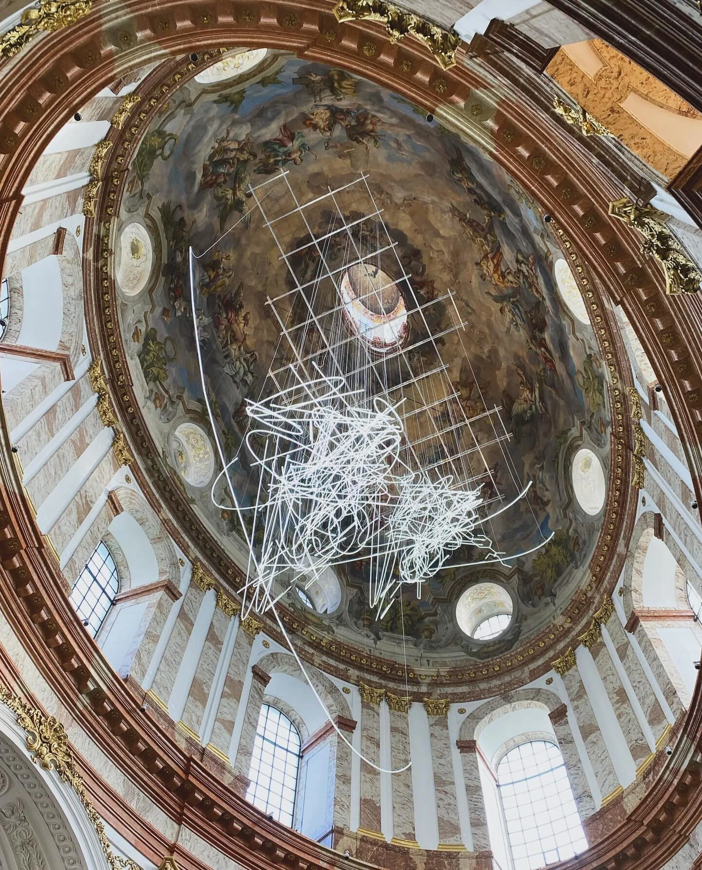 🪽🪽Cerith Wyn Evans&lsquo; &bdquo;Forms through Folds (ascending)&ldquo; engulfed by Johann Bernhard Fischer von Erlach  in Vienna&rsquo;s magnificent Karlskirche. The site specific, 700 meter long neon installation is one of Evan&rsquo;s largest to
