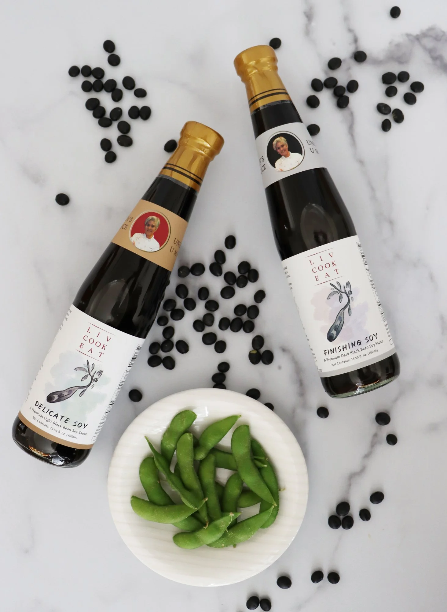 Liv Cook Eat Finishing Soy Sauce and Delicate Soy Sauce with black soy beans and plate of edamame