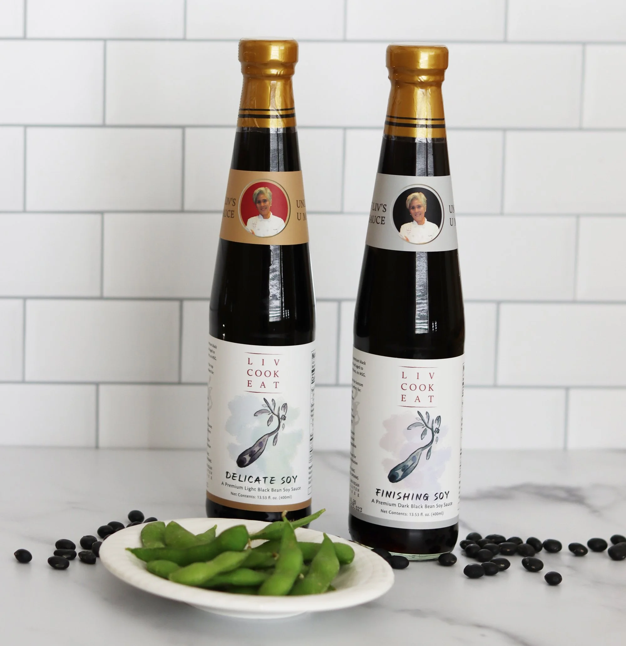 Liv Cook Eat Finishing Soy Sauce and Delicate Soy Sauce with black soy beans and plate of edamame