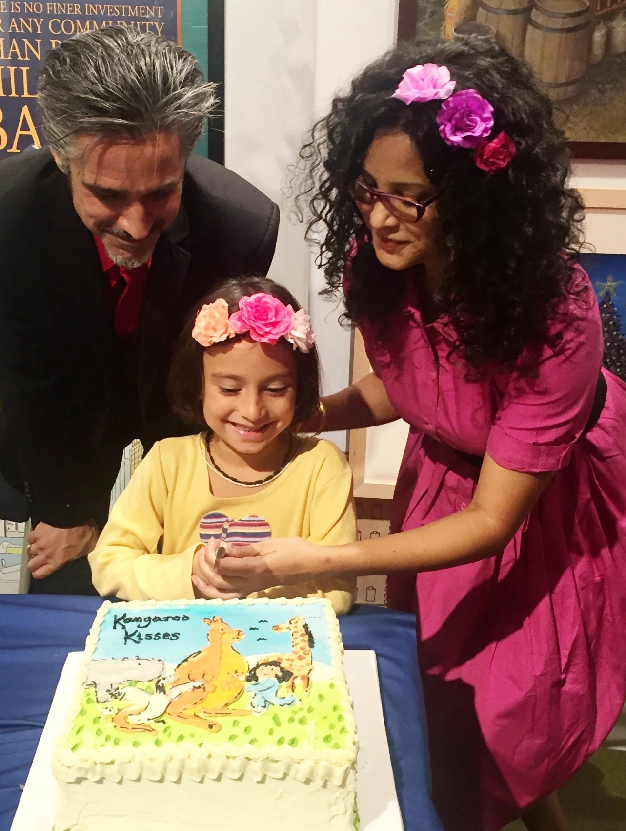Guest of Honor Sulakshana Reddy cuts the cake with David Ouimet of PGW at the New York launch of Kangaroo Kisses , Books of Wonder, September 25, 2016