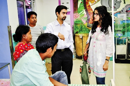 Dr. Hiteswar Sarma, The Centre's Medical Director, explains the post-operative care to Operation Smile India Ambassador Nandana Sen.