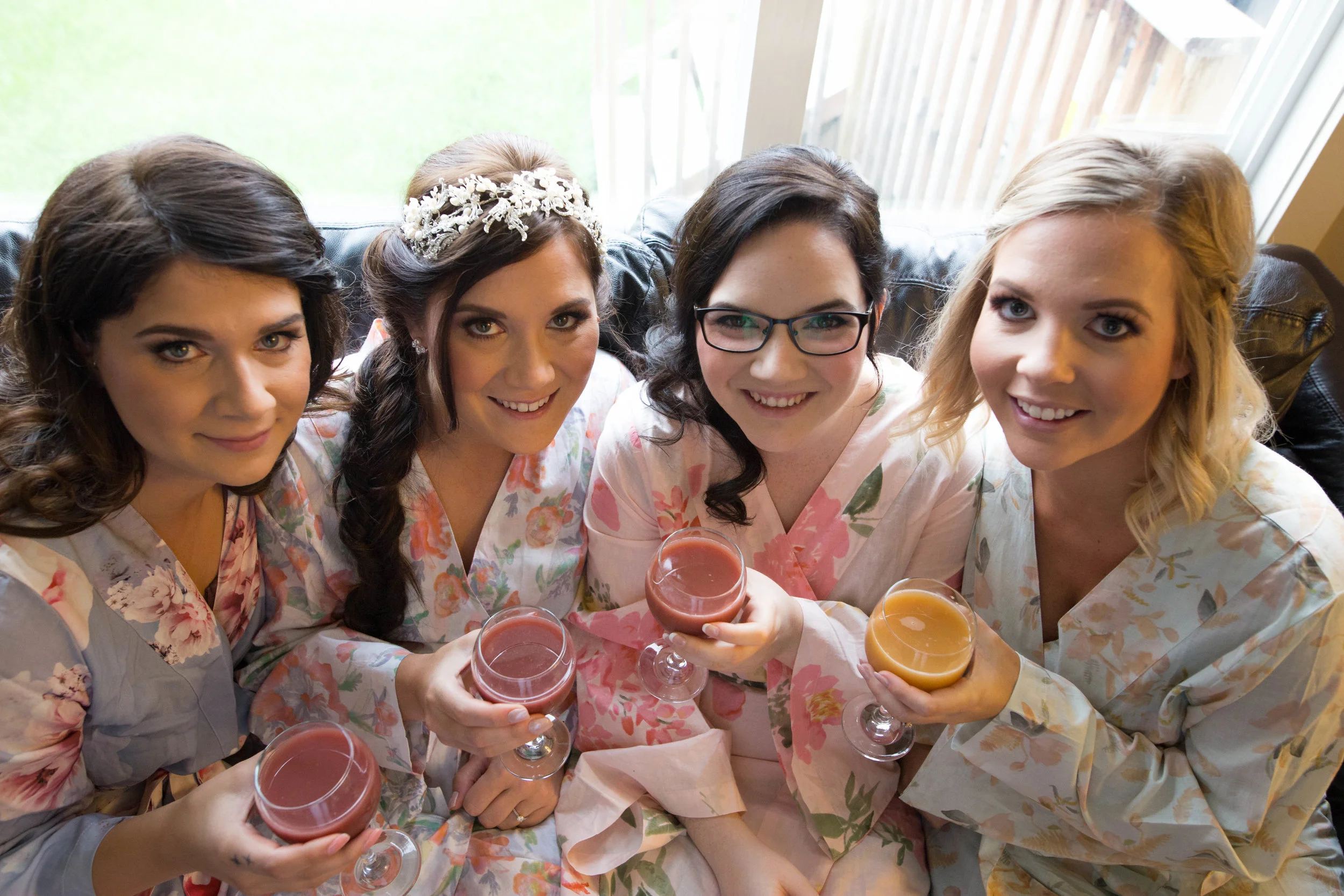 Bridesmaids drinking mimosas