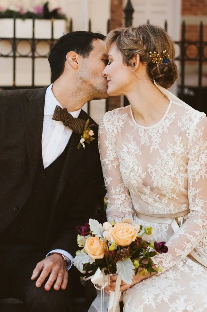 Jill and Michael Photography by JBM Photography . The wedding of Jill, in SHAREEN Bridal (the “ Lea ” with sleeves), and husband Michael. Flowers by Stem . Veil by Ashley Lietzel Reichenbach . Venue is Cobble Hill in Brooklyn, NY.