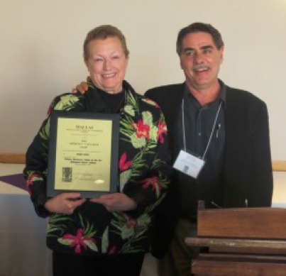 Maria Roof receiving the Whitaker Prize from President Michael Schroeder at Ithaca College, MACLAS 2015.
