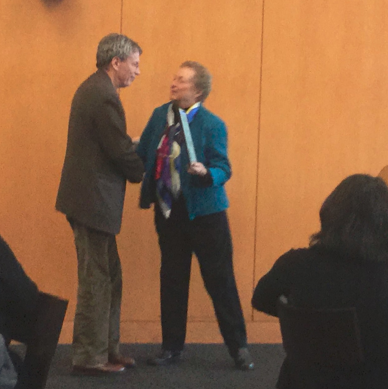 Mark Wasserman of Rutgers University accepts the 2016 Whitaker Prize for best book from María Roof.