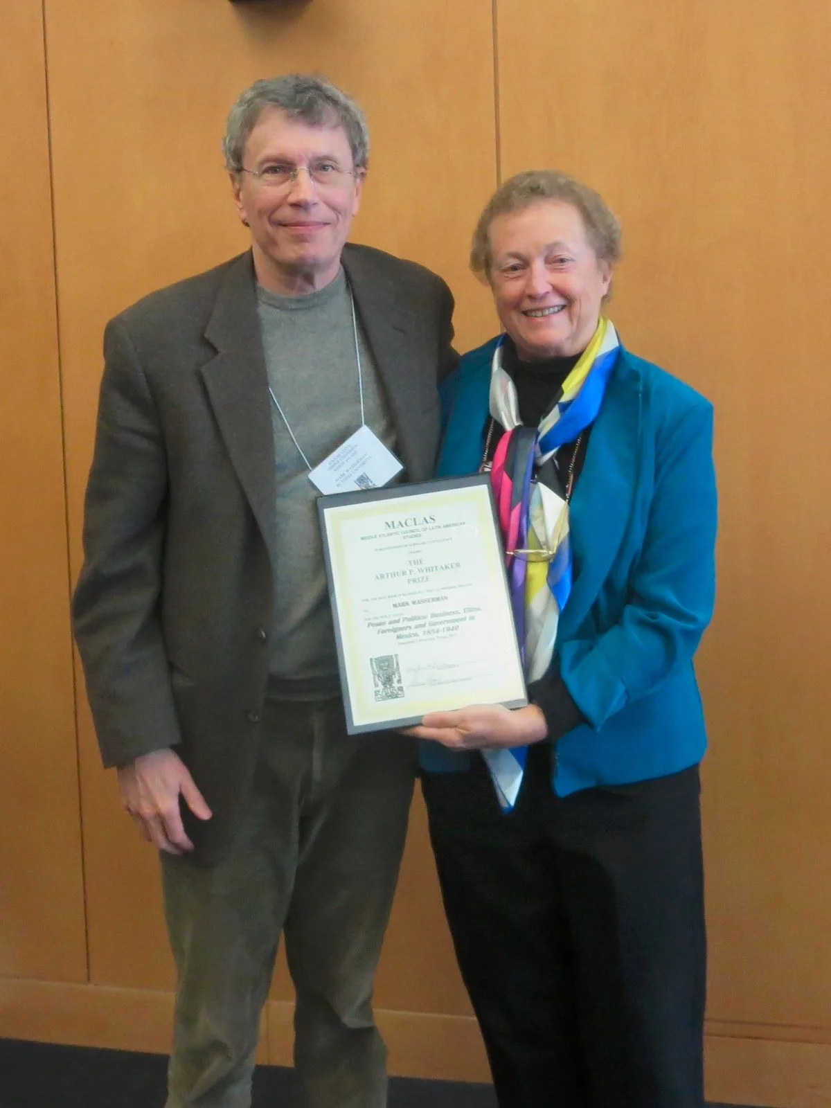 Whitaker Prize Committee Chair María Roof presenting the Whitaker Prize to Mark Wasserman.