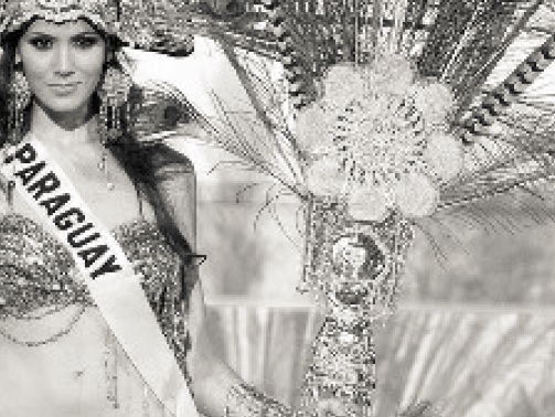 From Christina Turner, "Textile Tradition and National Identity". Caption: "Figure 3. Miss Paraguay competing for Miss Universe in 2006 in her 'national costume' that utilizes ñandutí in the fan as part of the design motif. Needless to say, this is not a costume you would be likely to actually see in Paraguay!"