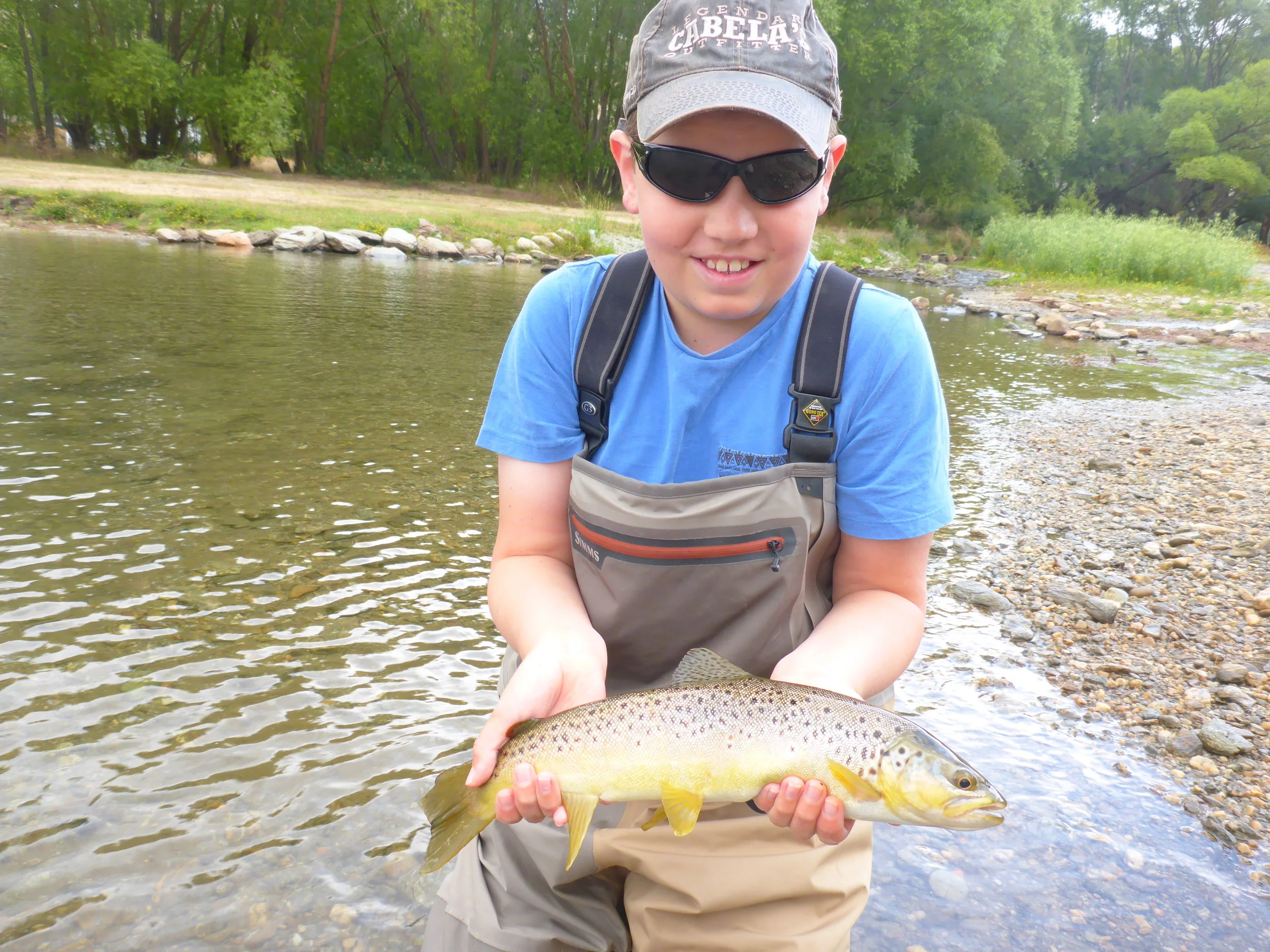 A happy young angler with his first on fly!