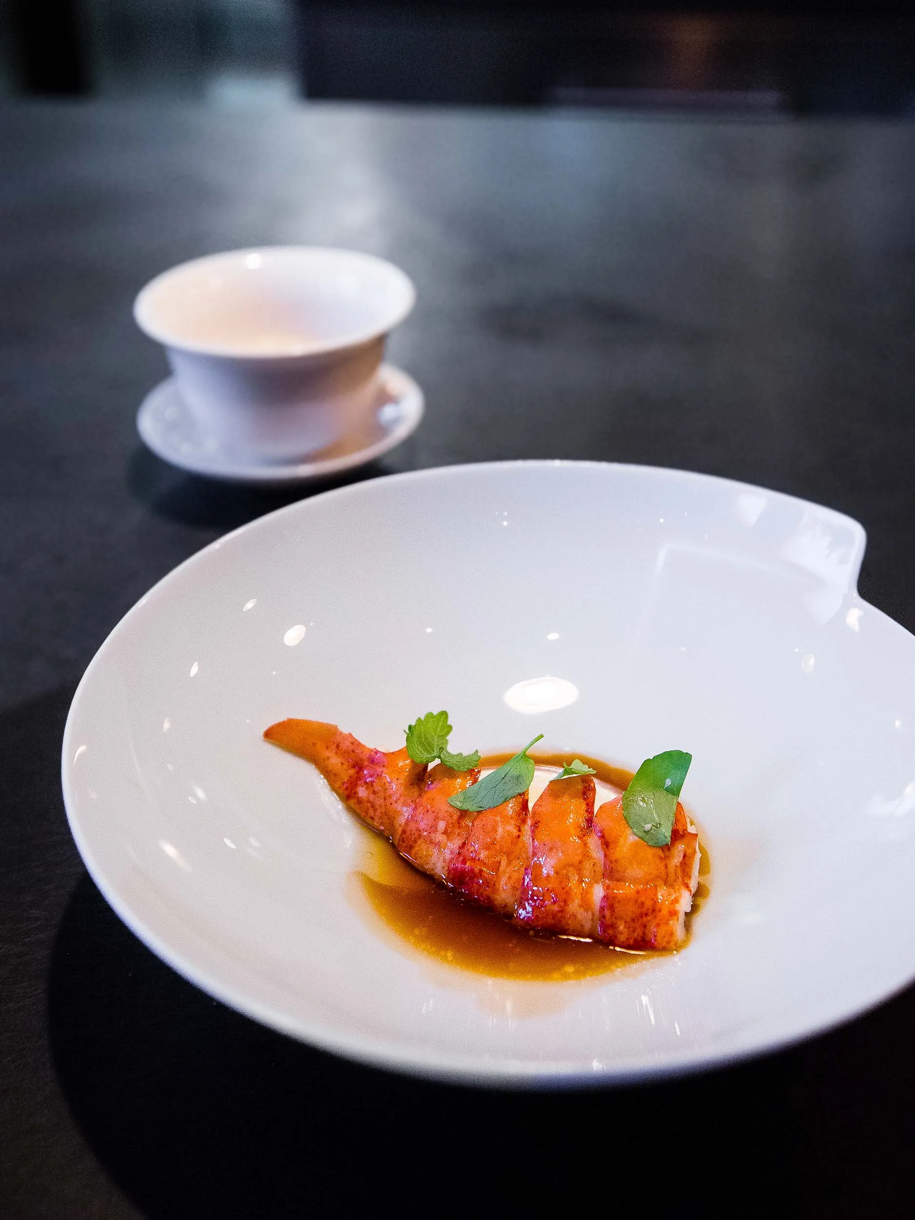 Nova Scotia Lobster poached in Brown Butter with a Celeriac and Yuzu Purée and Lobster Bouillon. Served with a Lobster and Camomile Bisque 'tea'