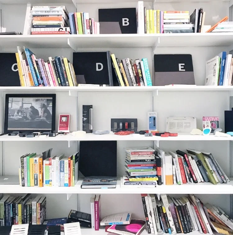 So many design reads - my favorite thing on this shelf are the Disney magic band prototypes!